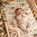 Baby lying on the Reindeer Sleigh Crib Sheet
