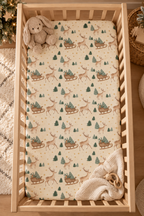 Reindeer Sleigh Crib Sheet seen from above in a wooden crib