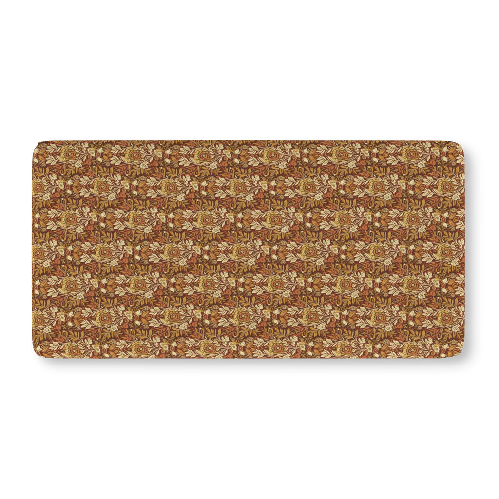 Rust Boho Floral Crib Sheet laid flat in Standard size with boho flowers in mustard and cream on rust