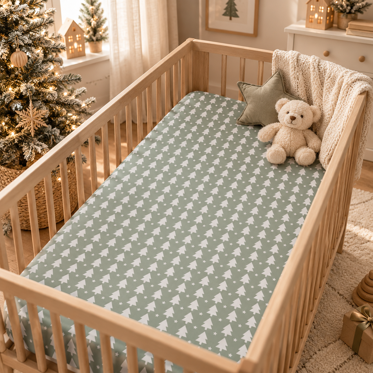 Sage Christmas Tree Crib Sheet on a wooden crib mattress in a Christmas nursery