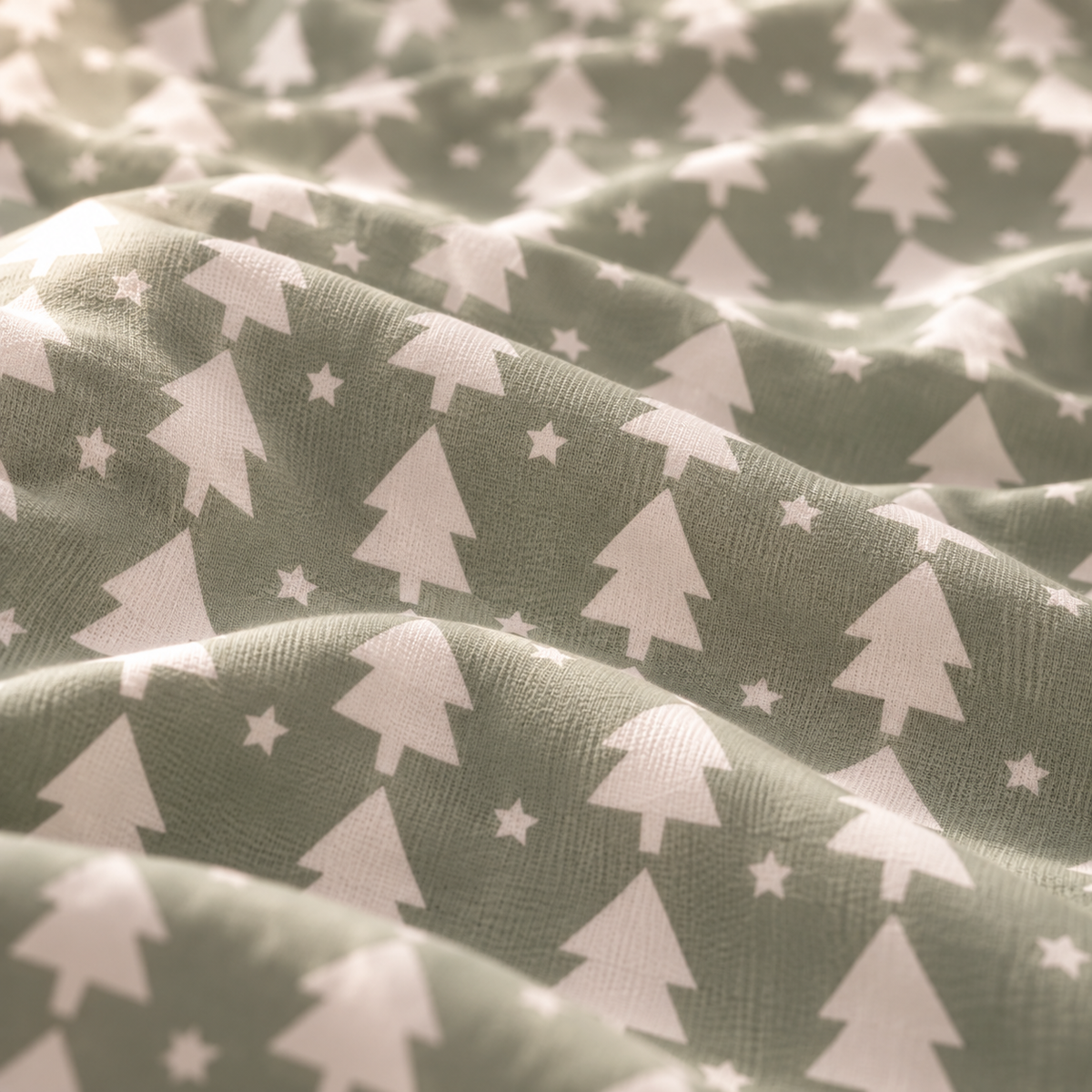 Close-up of the Sage Christmas Tree Crib Sheet fabric showing white Christmas trees and stars on sage green
