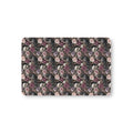 Skull Rose Crib Sheet laid flat in Mini size with skulls, ravens and dusky roses on black