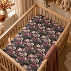 Skull Rose Crib Sheet on a wooden crib mattress in a gothic nursery