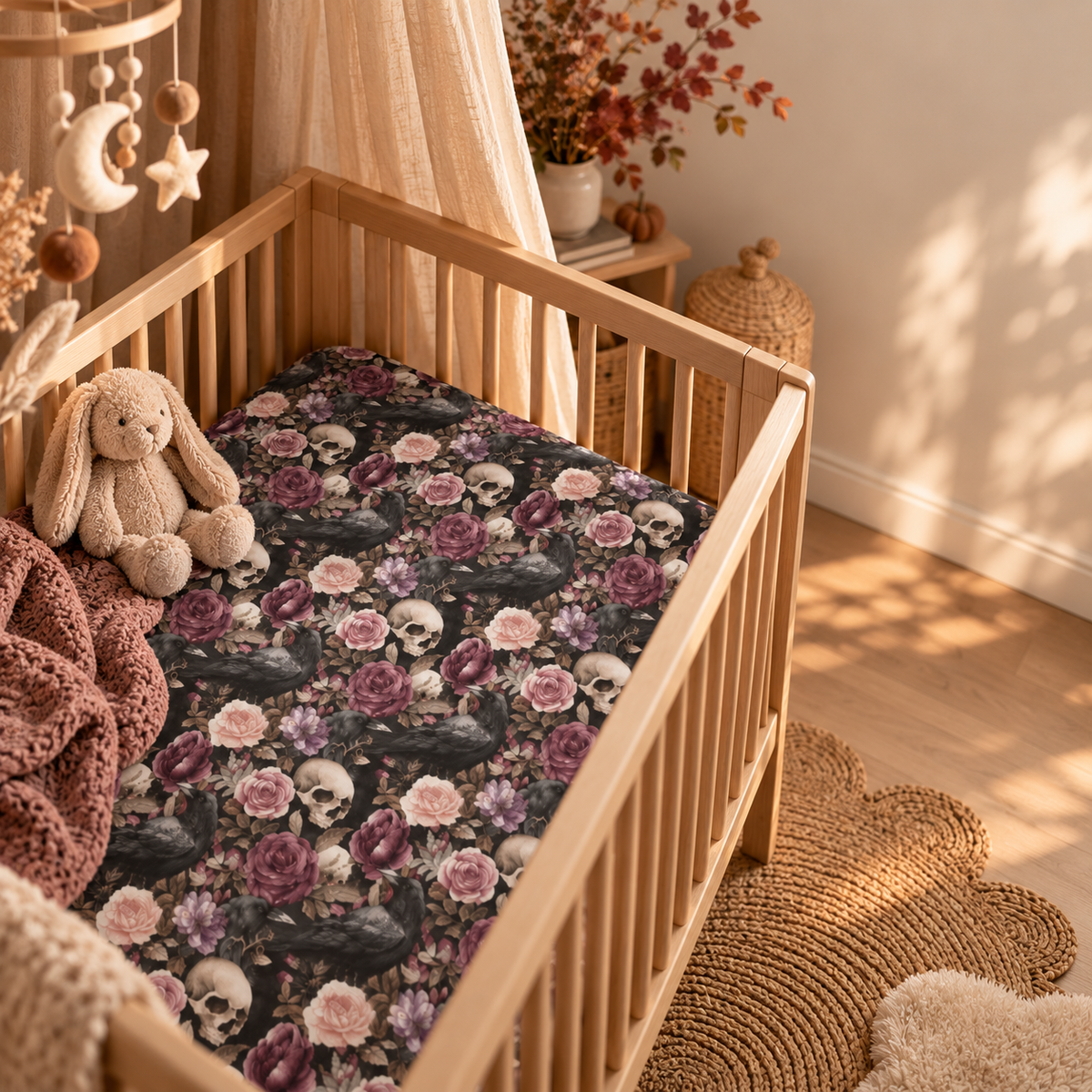 Skull Rose Crib Sheet in a wooden crib in a sunlit nursery