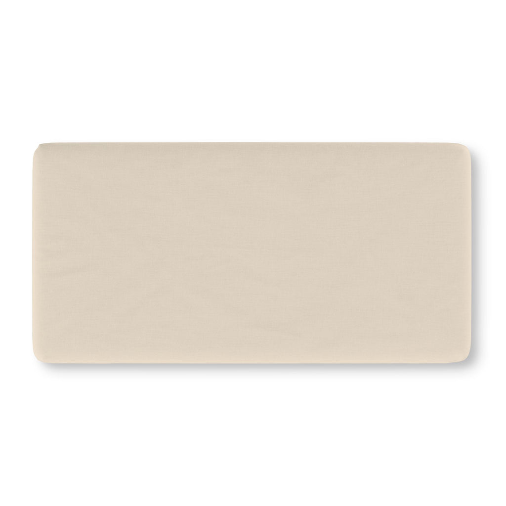 Solid Beige Crib Sheet laid flat in Standard size in a plain warm beige