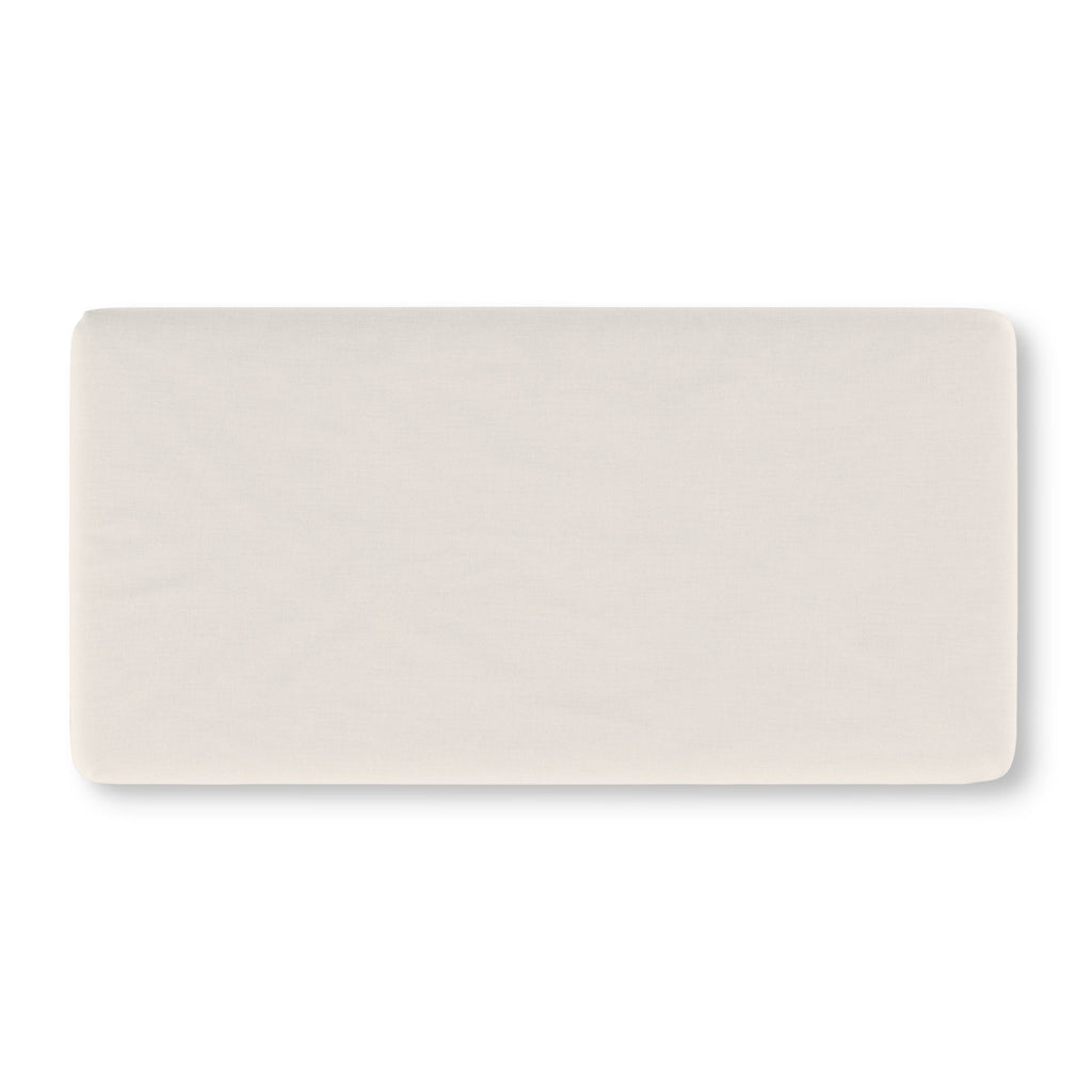 Solid Ivory Crib Sheet laid flat in Standard size in a plain ivory white