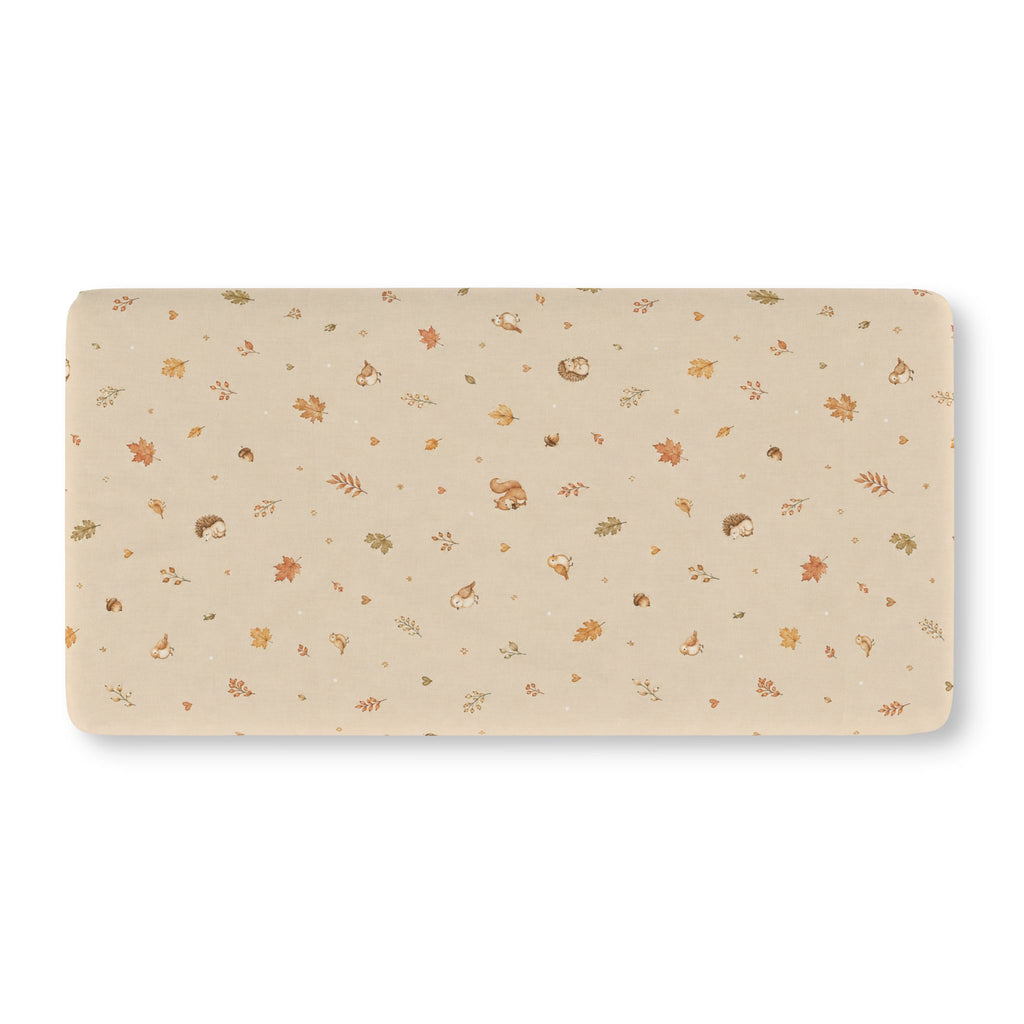 Squirrel Woodland Crib Sheet laid flat in Standard size with tiny squirrels, hedgehogs and autumn leaves on beige