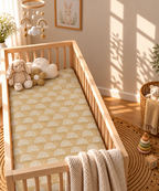 Tan Boho Rainbow Crib Sheet in a wooden crib in a sunlit nursery