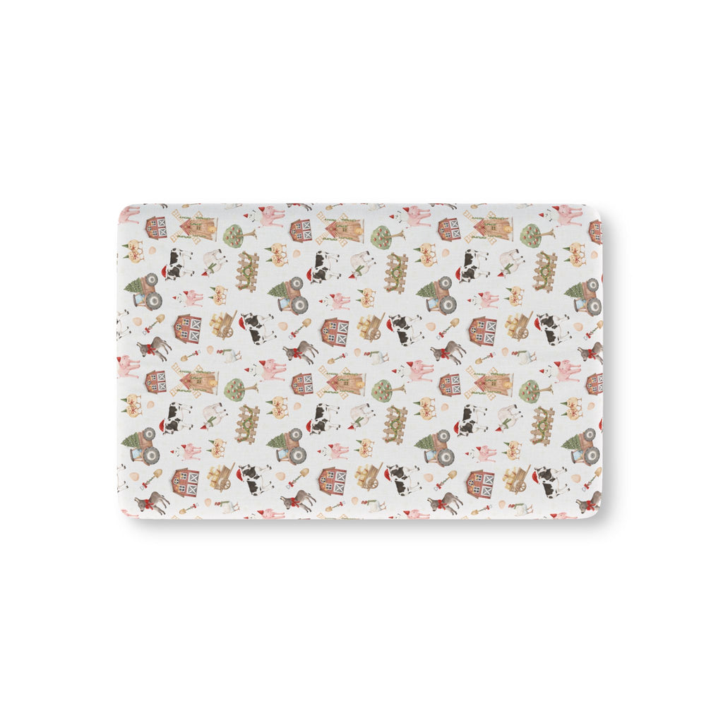 White Christmas Farm Crib Sheet laid flat in Mini size with farm animals in Santa hats on white