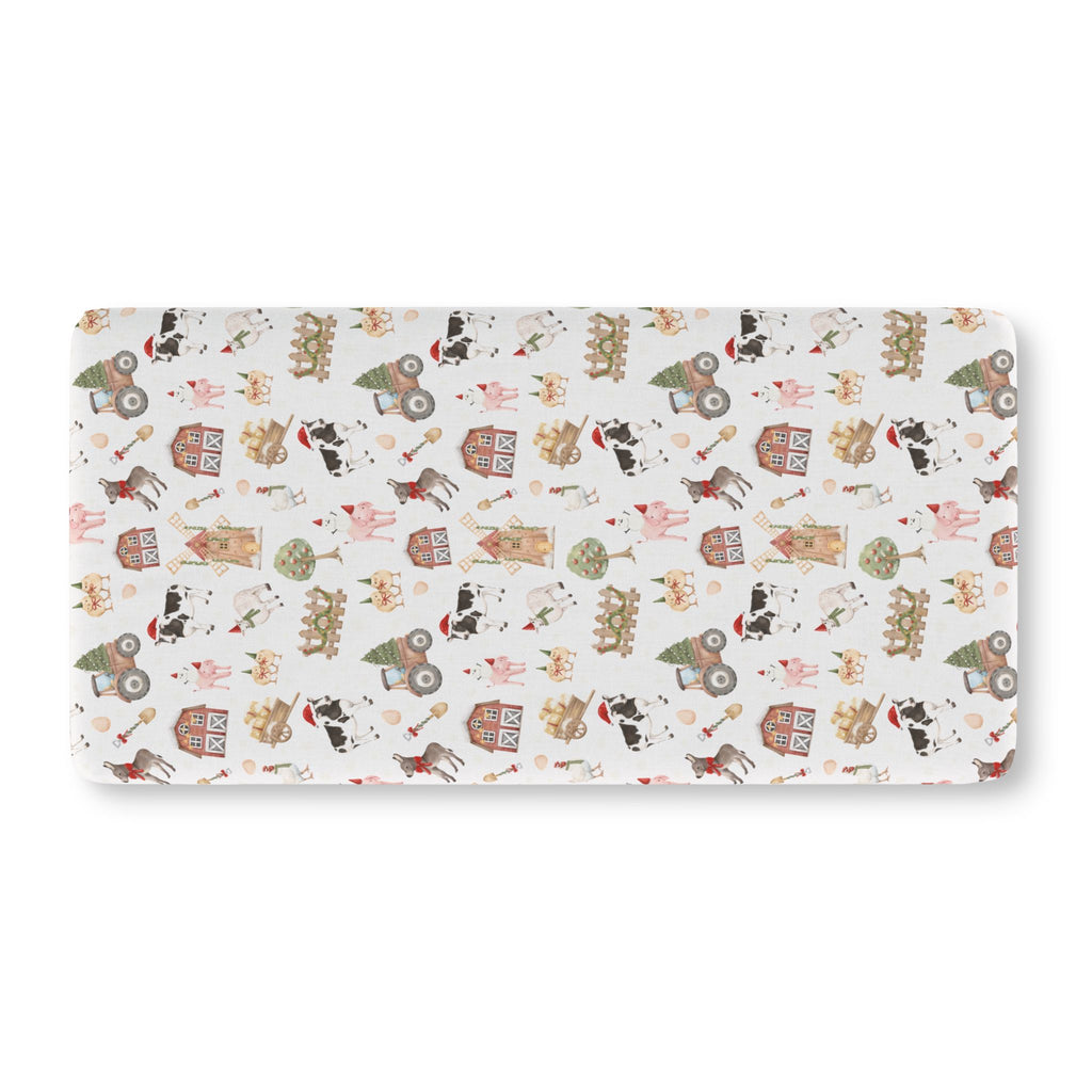 White Christmas Farm Crib Sheet laid flat in Standard size with farm animals in Santa hats on white
