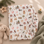 White Christmas Farm Crib Sheet folded to show the elastic fitted edge