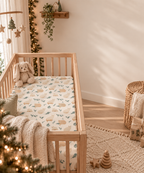 Winter Cat Crib Sheet in a wooden crib in a sunlit nursery
