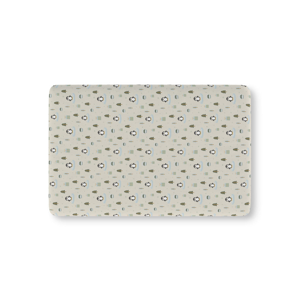 Winter Penguin Crib Sheet laid flat in Mini size with penguins and pine trees on pale sage